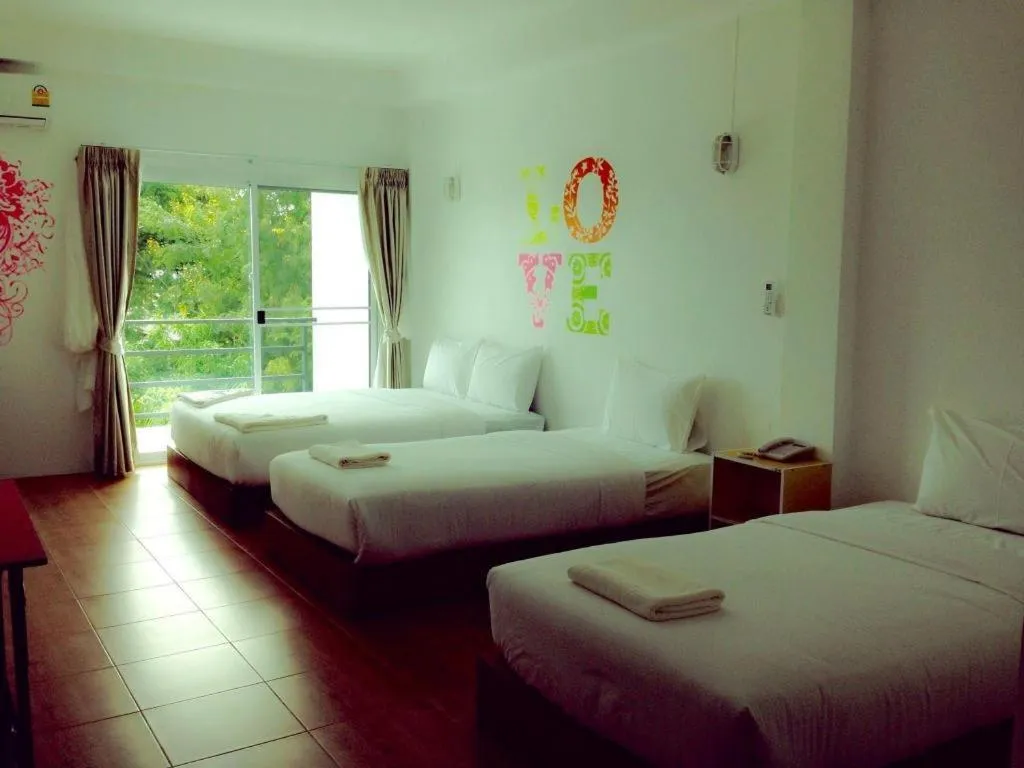 Bed in The Pride Hotel At Laemsing