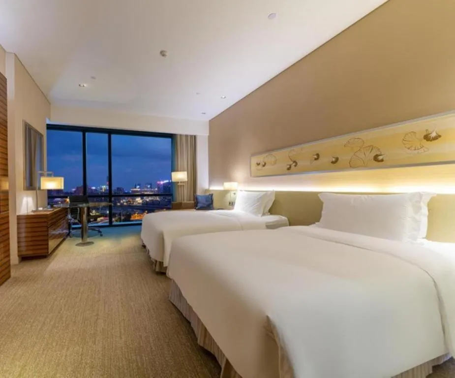 Bed in New World Guiyang Hotel