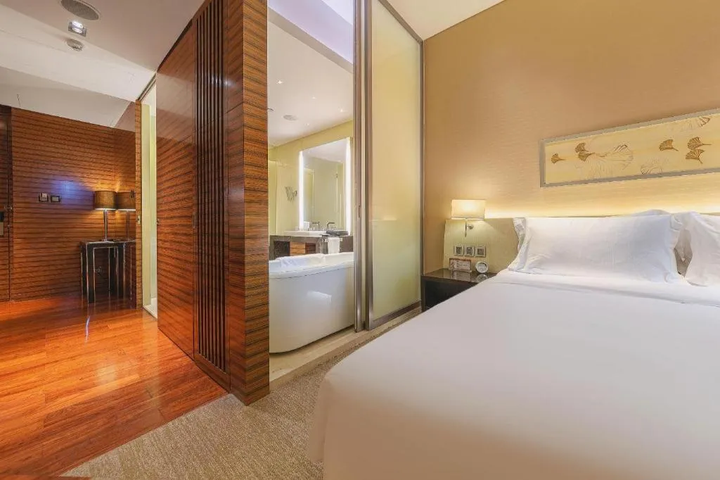 Bed in New World Guiyang Hotel