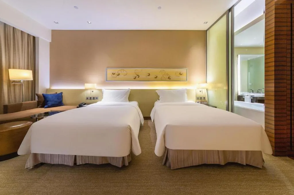 Bed in New World Guiyang Hotel