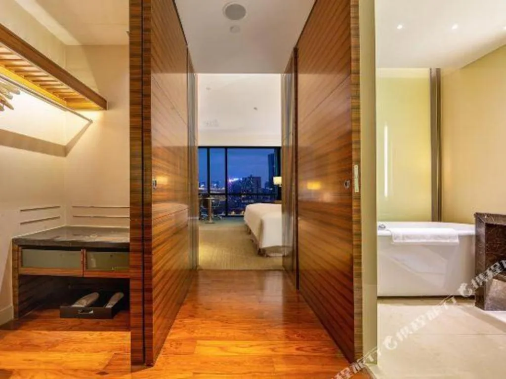 Bed in New World Guiyang Hotel