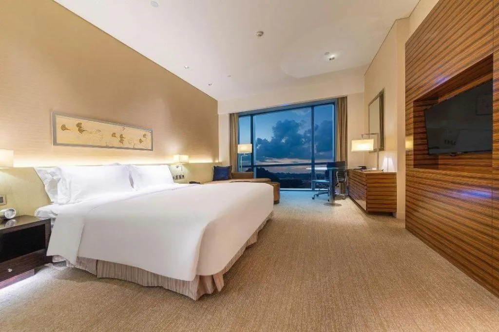 Bed in New World Guiyang Hotel