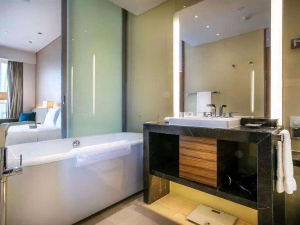 Bed in New World Guiyang Hotel