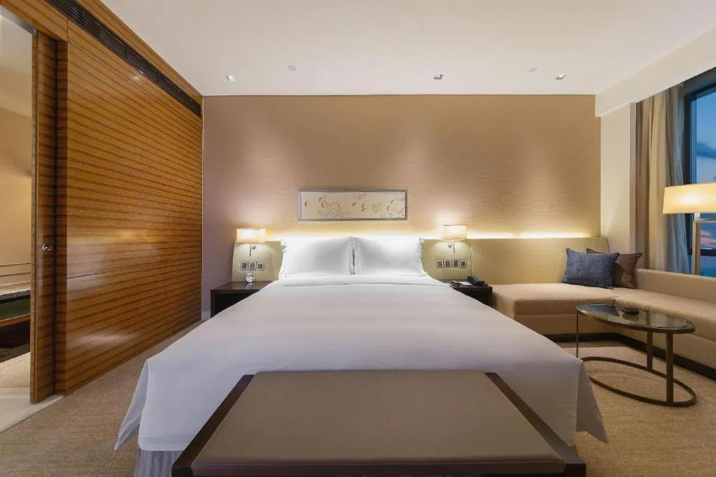 Bed in New World Guiyang Hotel