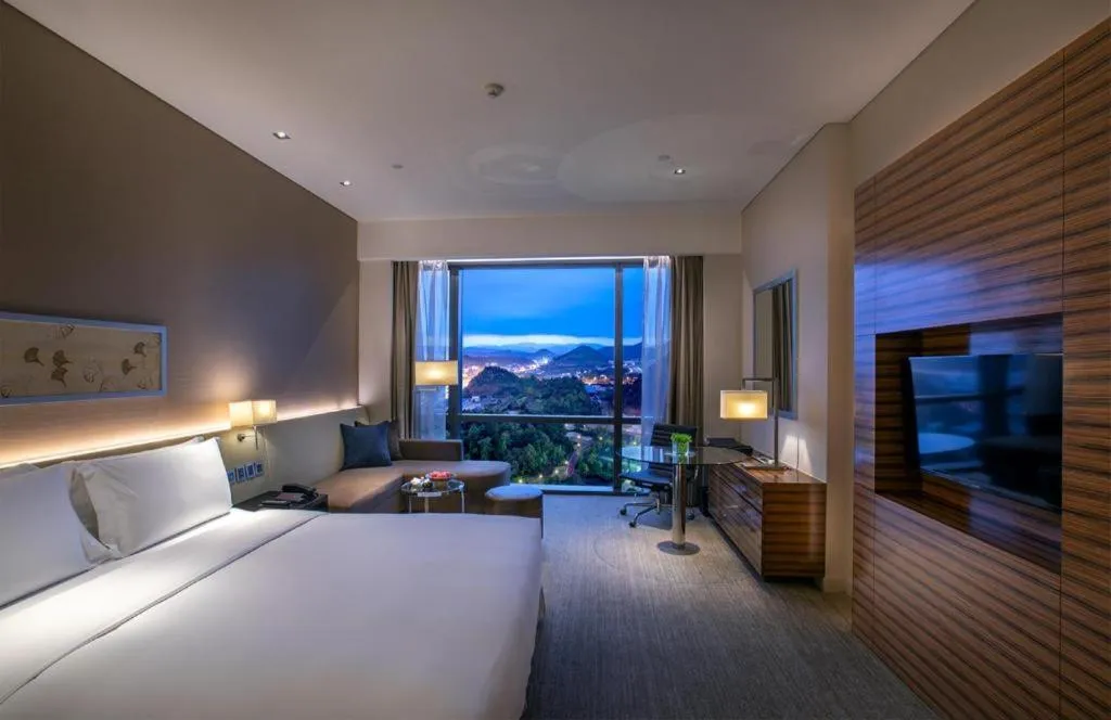 Bed in New World Guiyang Hotel