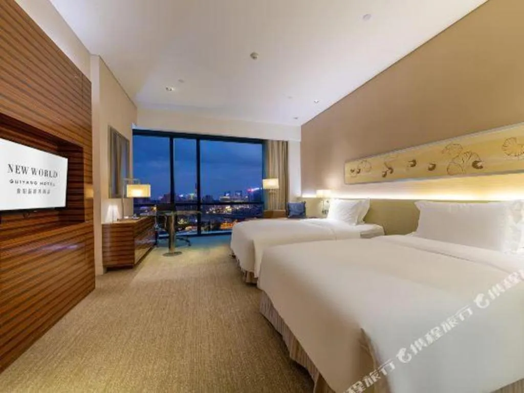 Bed in New World Guiyang Hotel