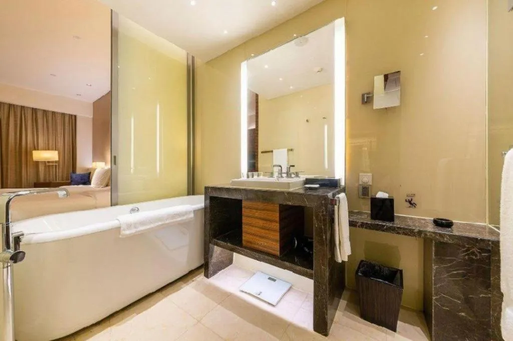 Bed in New World Guiyang Hotel