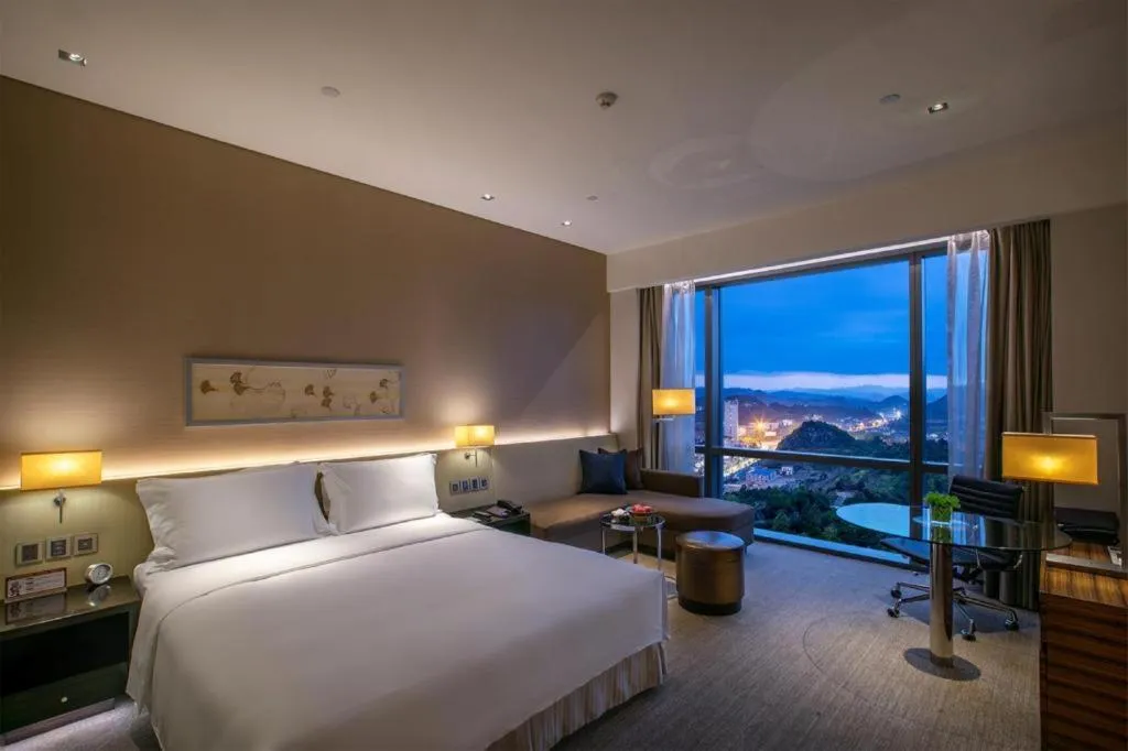 Bed in New World Guiyang Hotel