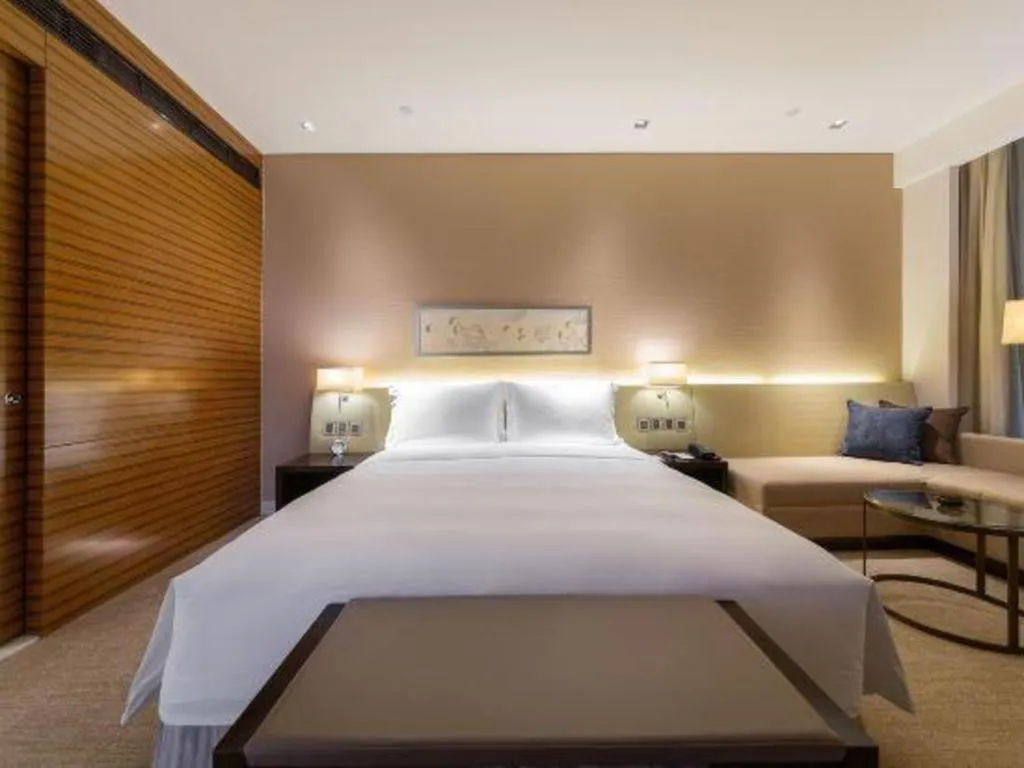 Bed in New World Guiyang Hotel