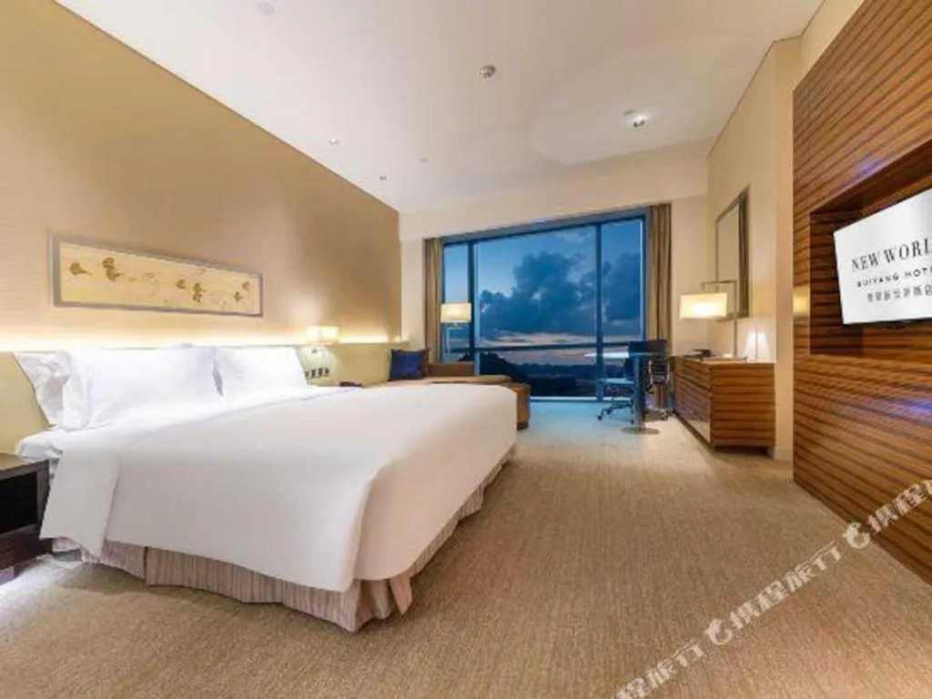 Bed in New World Guiyang Hotel