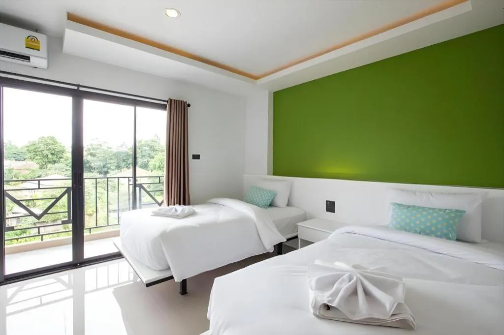 Bed in M Boutique Resort