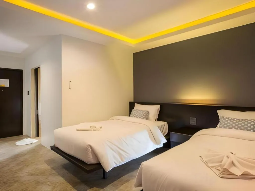 Bed in M Boutique Resort