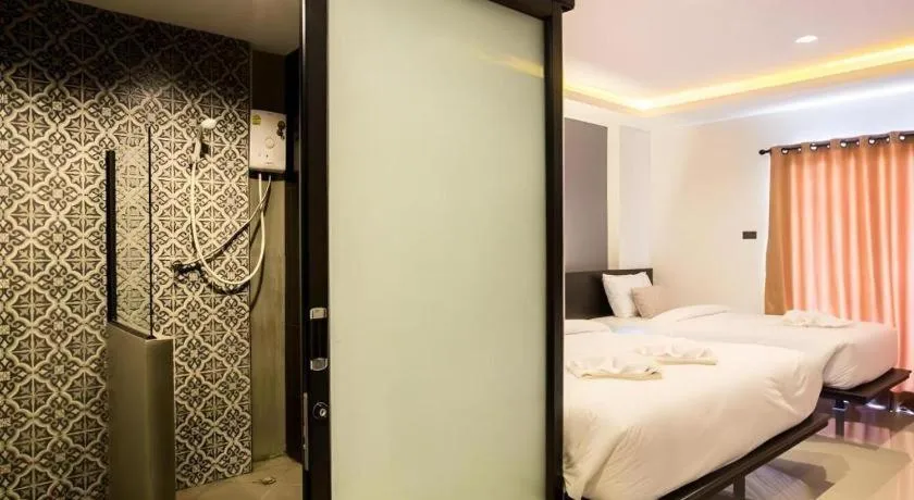 Bed in M Boutique Resort