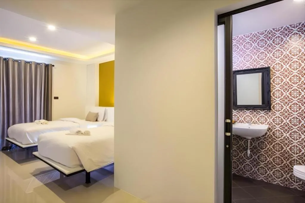 Bed in M Boutique Resort