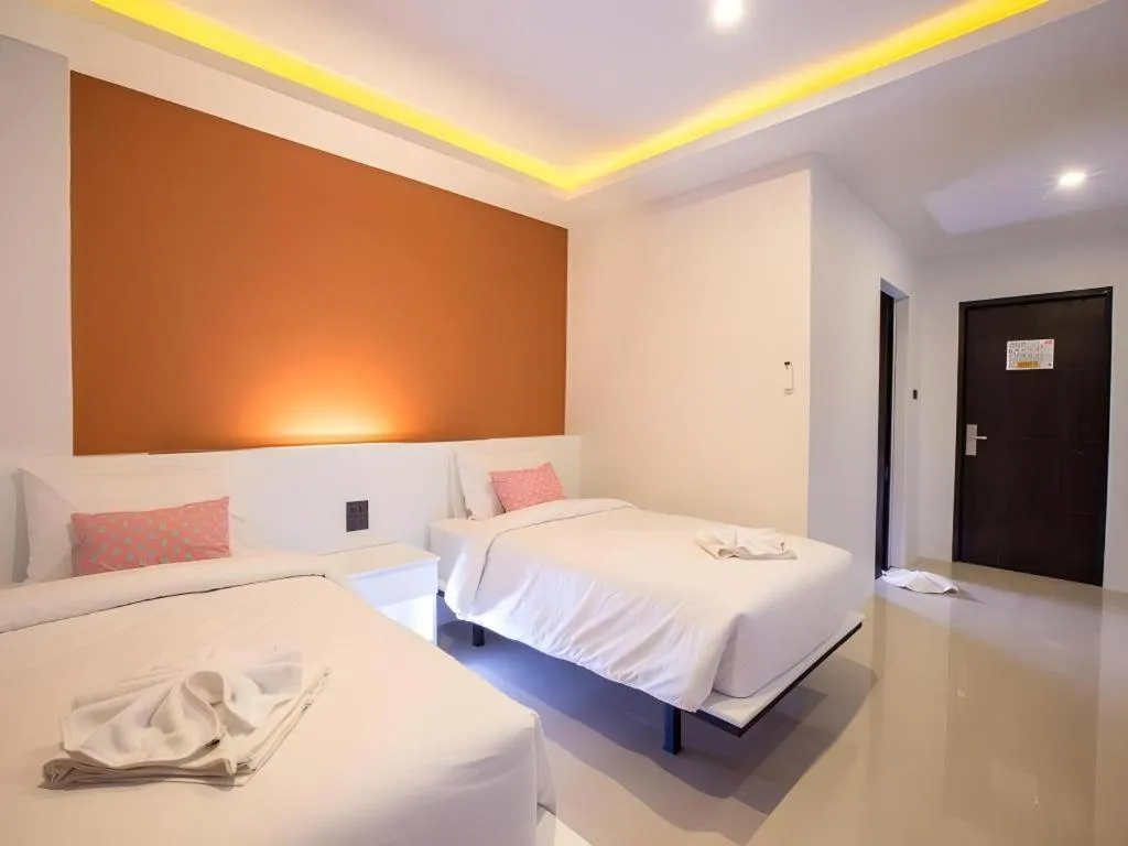 Bed in M Boutique Resort