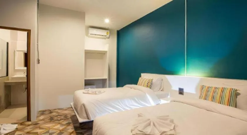 Bed in M Boutique Resort