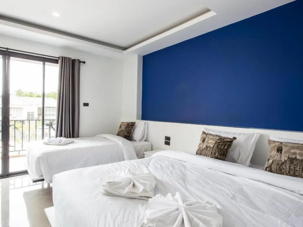 Bed in M Boutique Resort