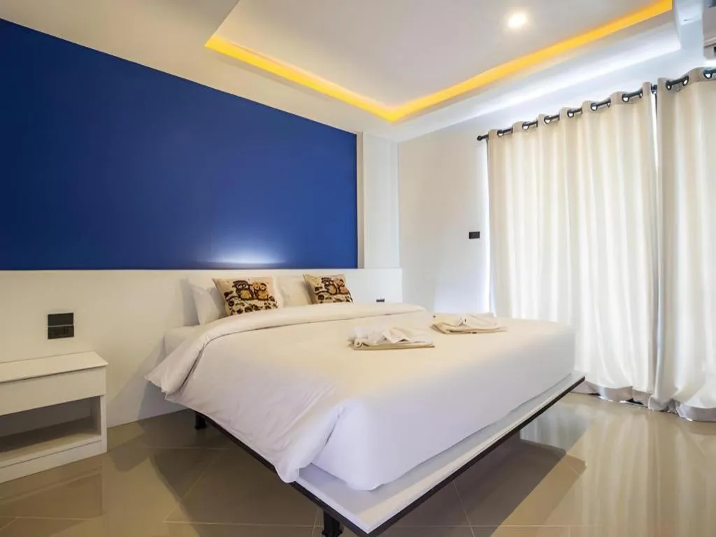 Bed in M Boutique Resort