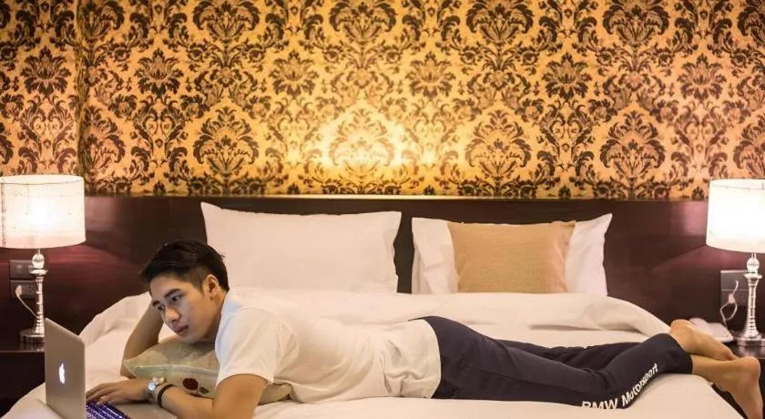 Bed in M Boutique Resort