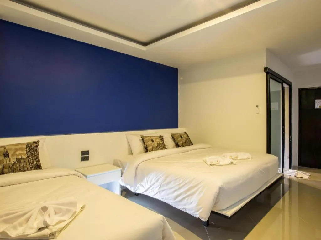 Bed in M Boutique Resort