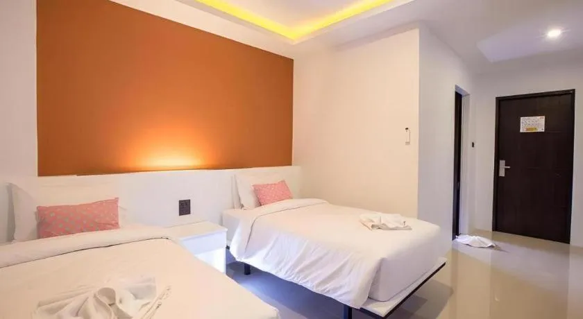 Bed in M Boutique Resort