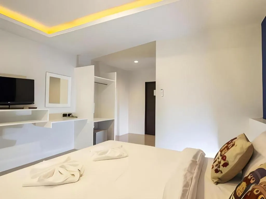 Bed in M Boutique Resort