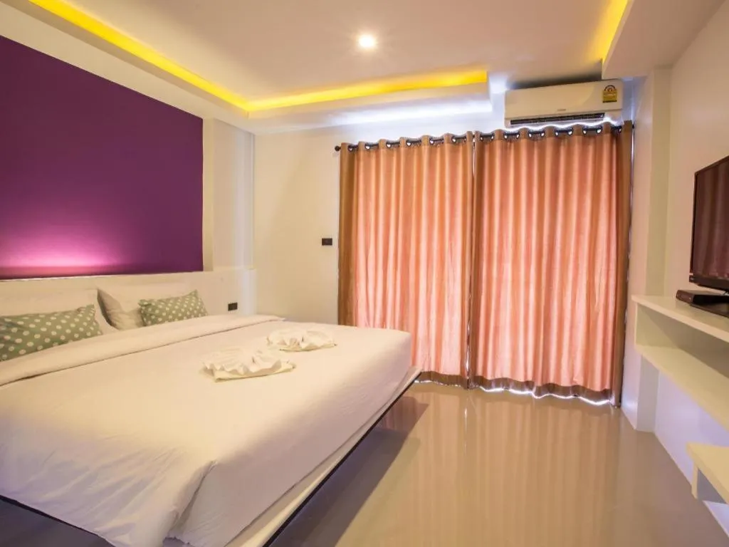 Bed in M Boutique Resort