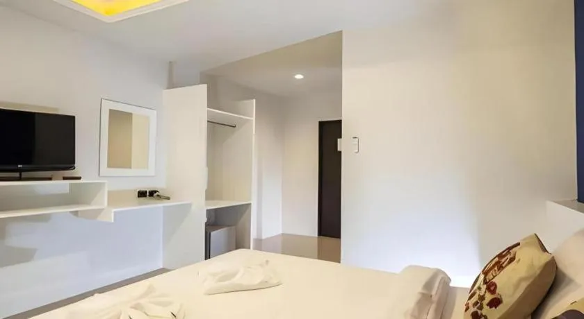 Bed in M Boutique Resort