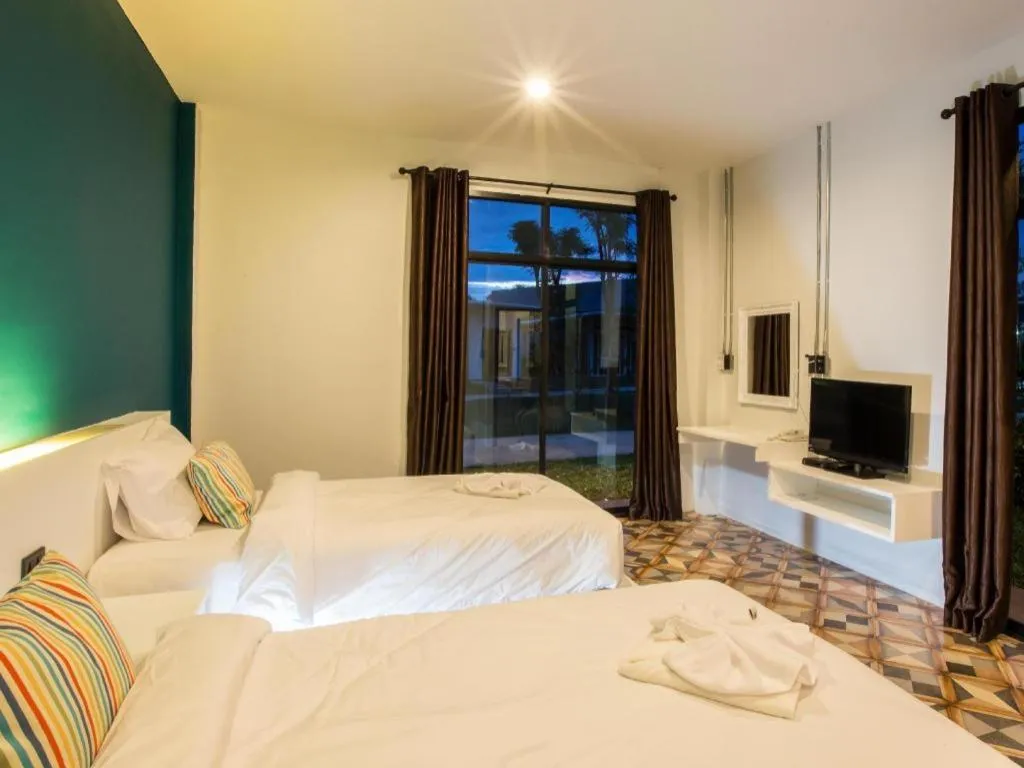 Bed in M Boutique Resort