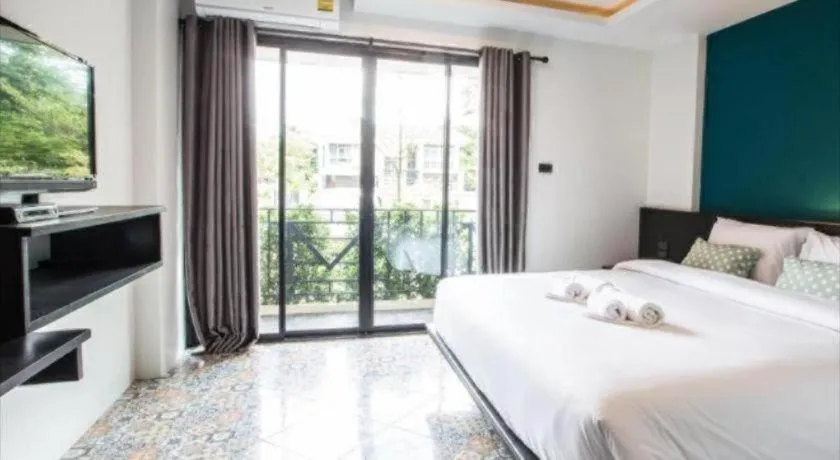 Bed in M Boutique Resort