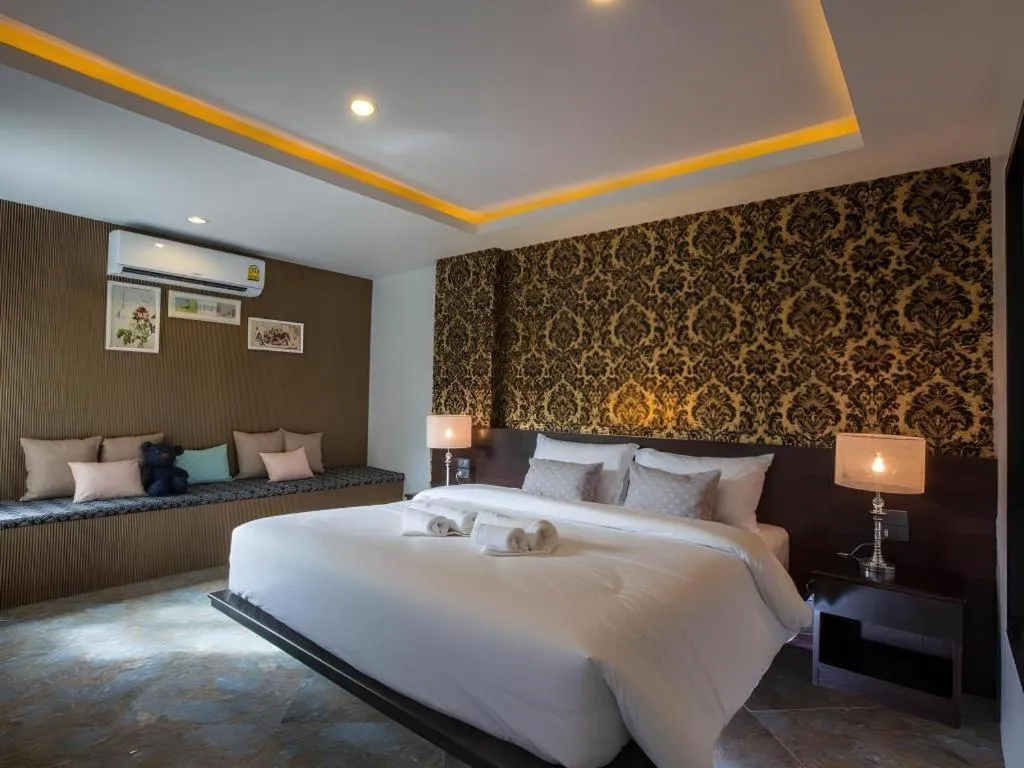 Bed in M Boutique Resort