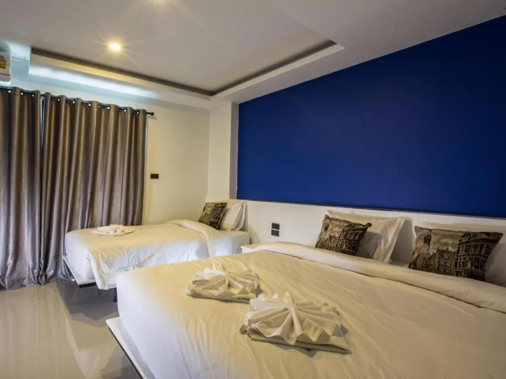 Bed in M Boutique Resort