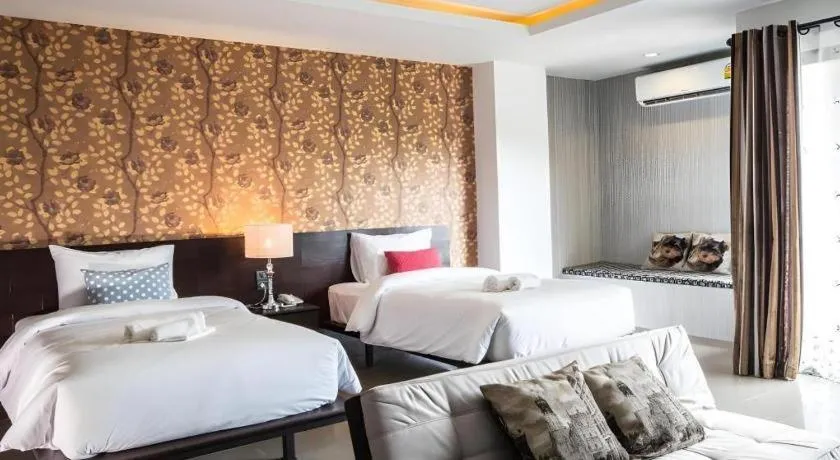 Bed in M Boutique Resort