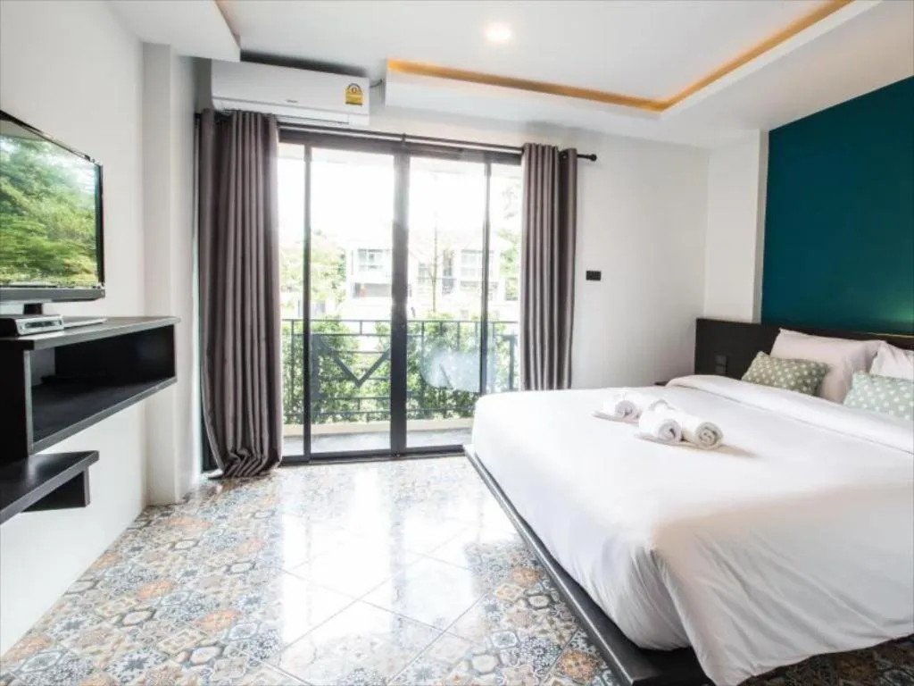 Bed in M Boutique Resort