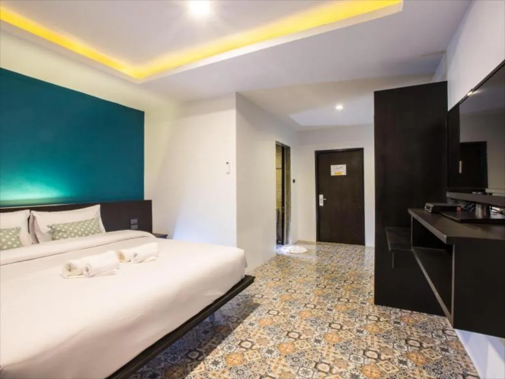 Bed in M Boutique Resort