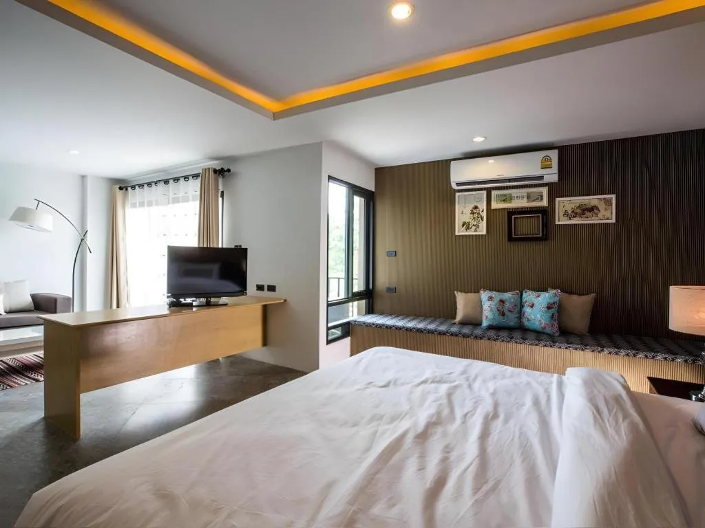 Bed in M Boutique Resort