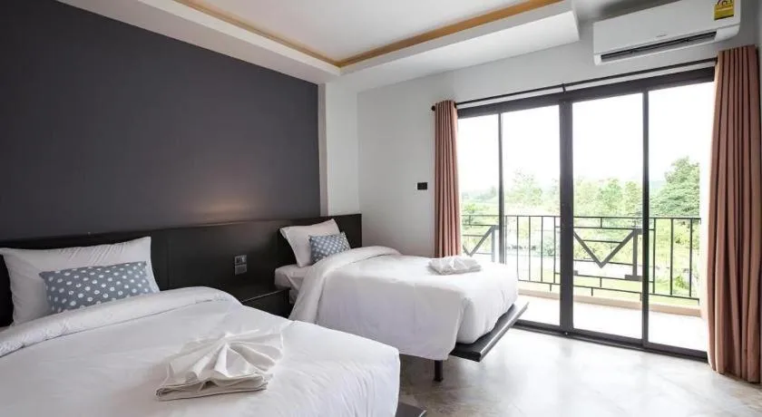 Bed in M Boutique Resort