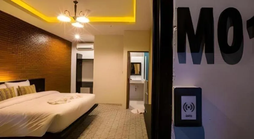 Bed in M Boutique Resort