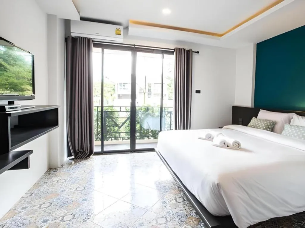 Bed in M Boutique Resort