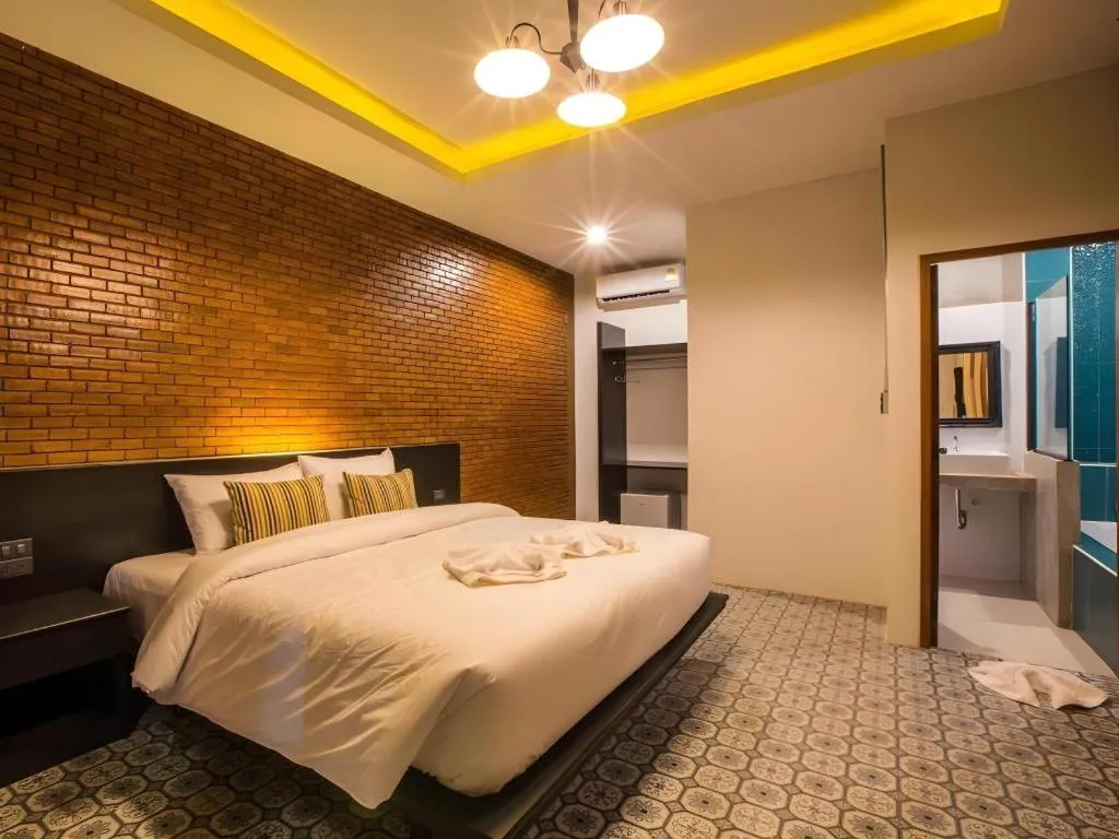 Bed in M Boutique Resort