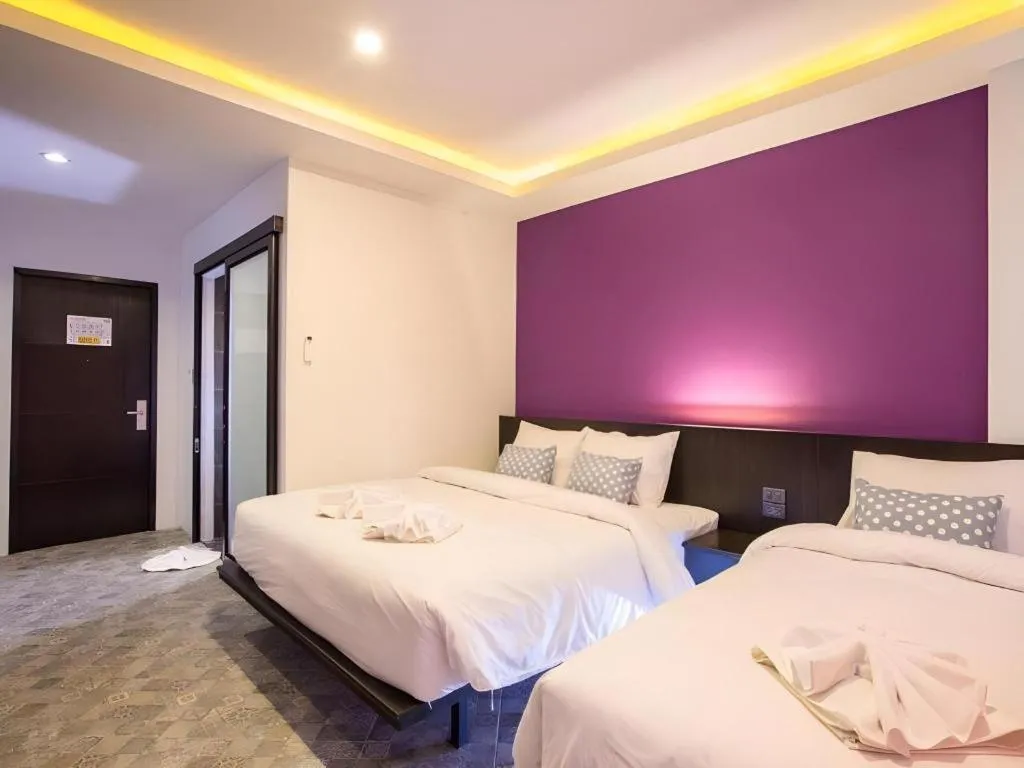 Bed in M Boutique Resort