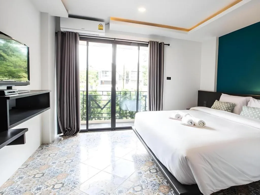 Bed in M Boutique Resort