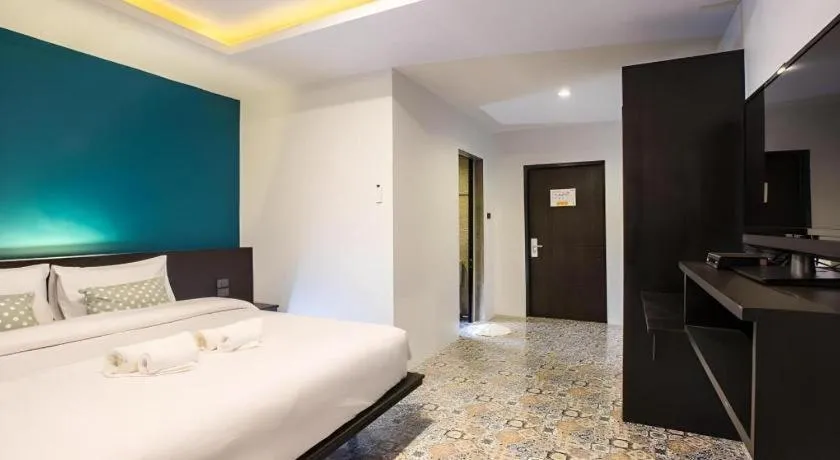 Bed in M Boutique Resort