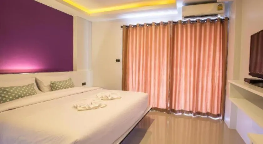 Bed in M Boutique Resort