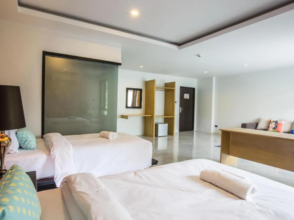 Bed in M Boutique Resort