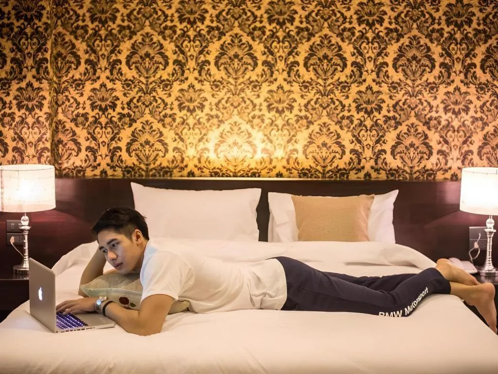 Bed in M Boutique Resort