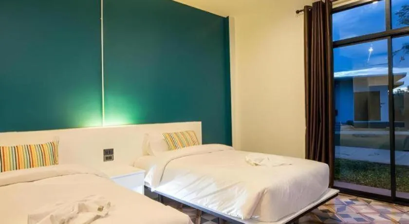 Bed in M Boutique Resort