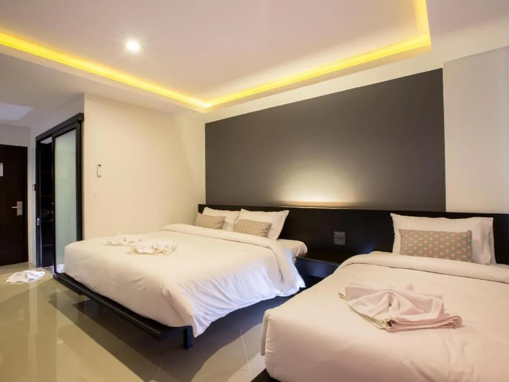 Bed in M Boutique Resort