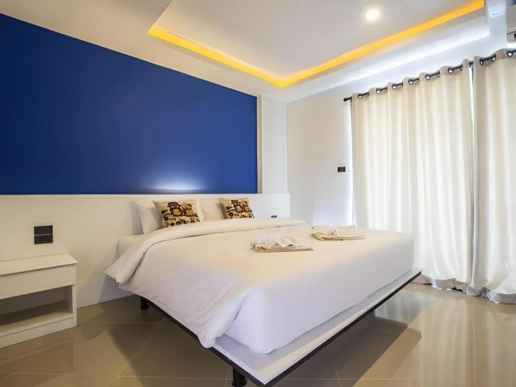 Bed in M Boutique Resort