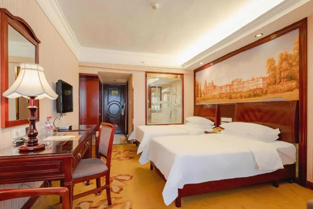 Bed in Vienna Hotel Nanning Train Station